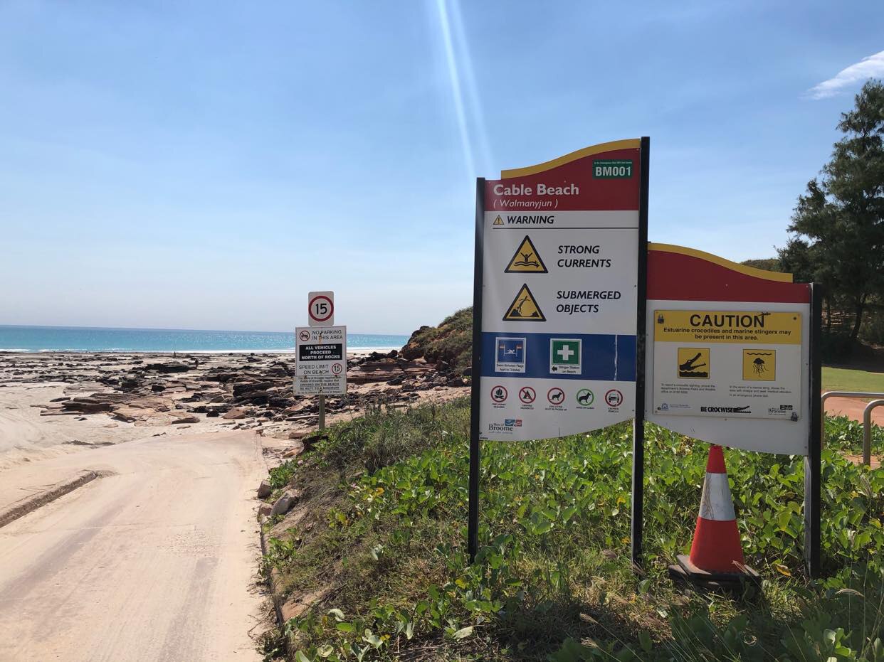 Warning signs in front of Cable Beach.