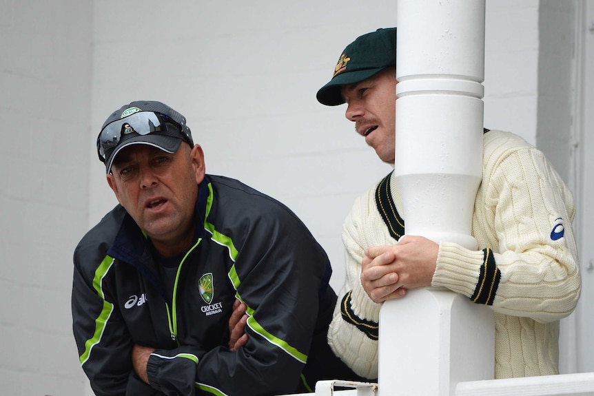 Warner watches from the balcony