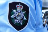 Badge on the sleeve of Australian Federal Police officer's uniform.