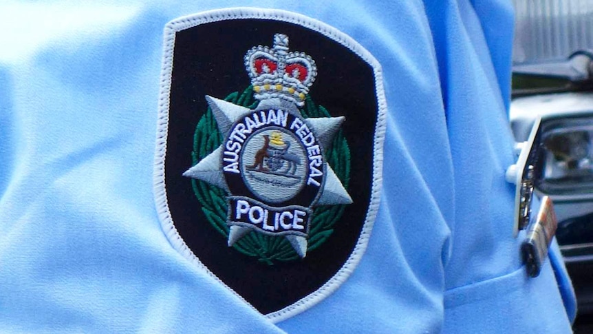 Badge on the sleeve of Australian Federal Police officer's uniform.