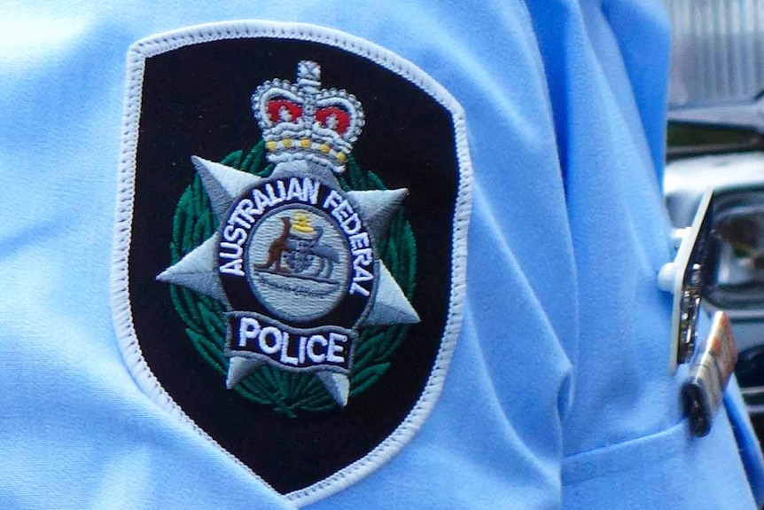 Badge on the sleeve of Australian Federal Police officer's uniform.