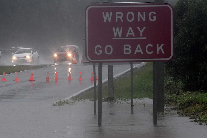 Cars drive on the Pacific highway near Mudgeeraba