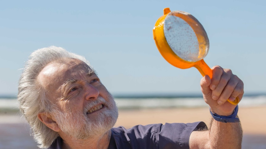 Alan Jones uses a sieve to search for amphipods