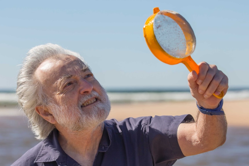 Alan Jones uses a sieve to search for amphipods