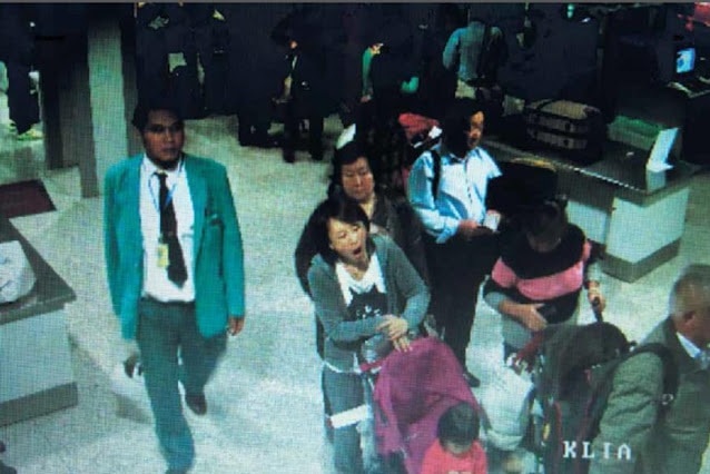 CCTV vision of man with lanyard from airport security at Malaysian airport before the ill fated MH370 flight.