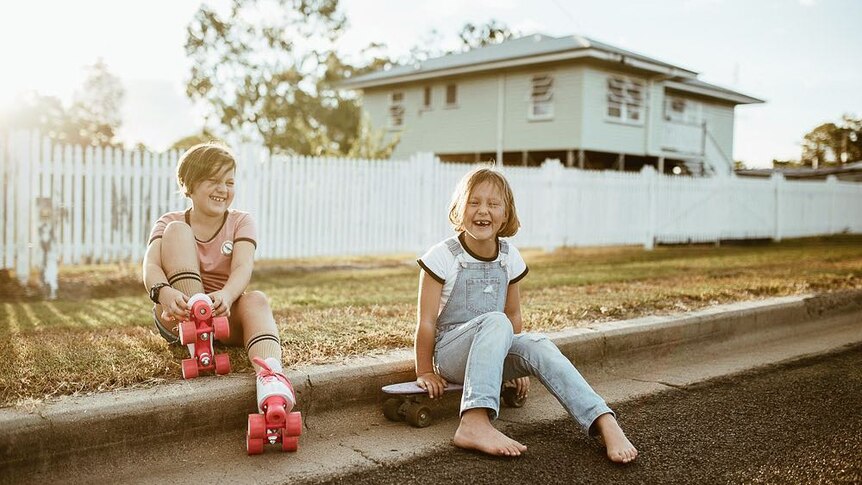 Two young girls enjoy some old-school skating fun in Texas, Queensland.