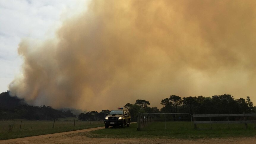 A fire burns in bushland in Tea Tree, north of Hobart