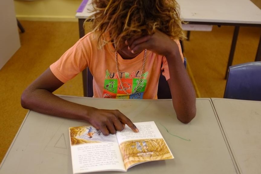 A student reading at the Warburton Campus of the Ngaanyatjarra Lands School.