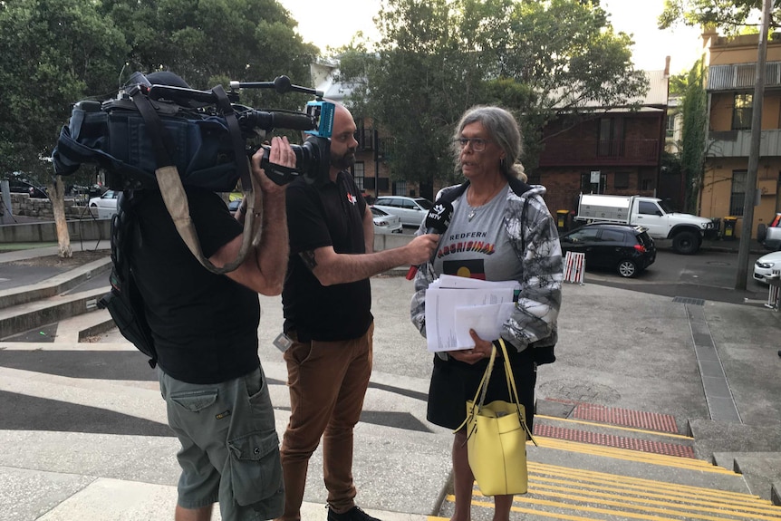 Jenny Munro, from the Mudgin-Gal Aboriginal Women's Centre in Redfern, speaks to reporters