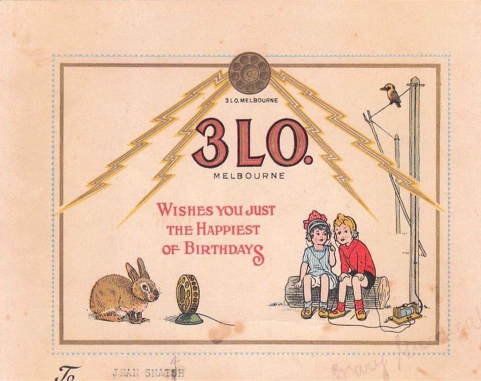 A card saying 3LO Melbourne wishes you just the happiest of birthdays with an illustration of two children and a rabbit