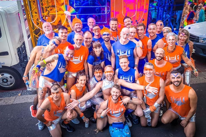 A group of people on a colourful Mardi Gras float.