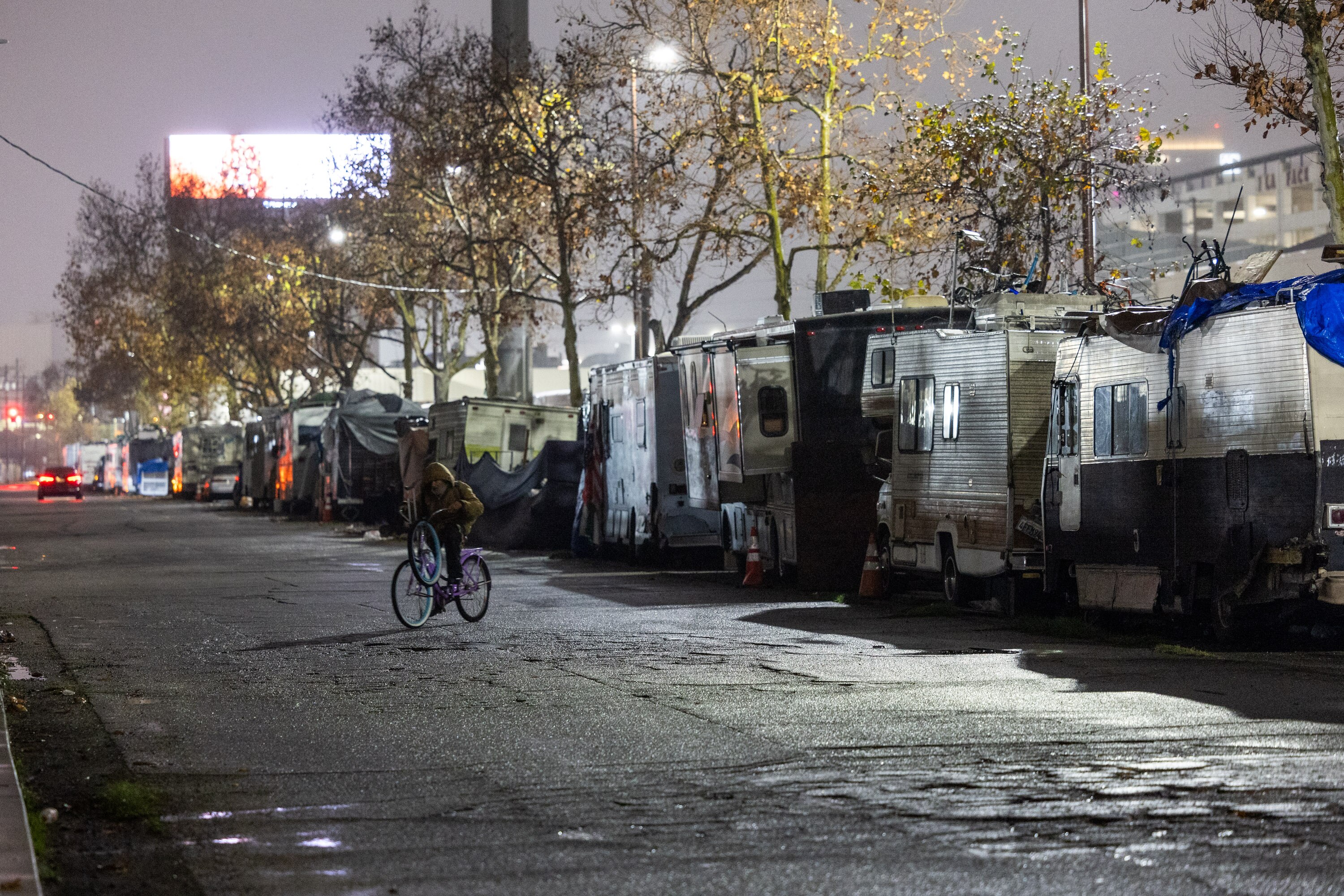 Homeless people shelter under tents in America.