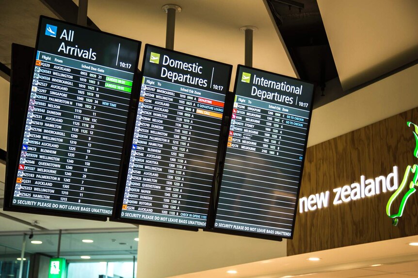 Departure boards at Christchurch Airport ahead of New Zealand's self-isolation policy.