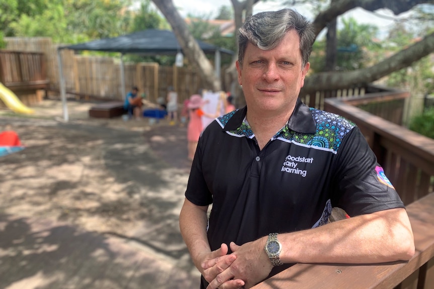 John Cherry leaning on the balcony of a Goodstart childcare centre. 