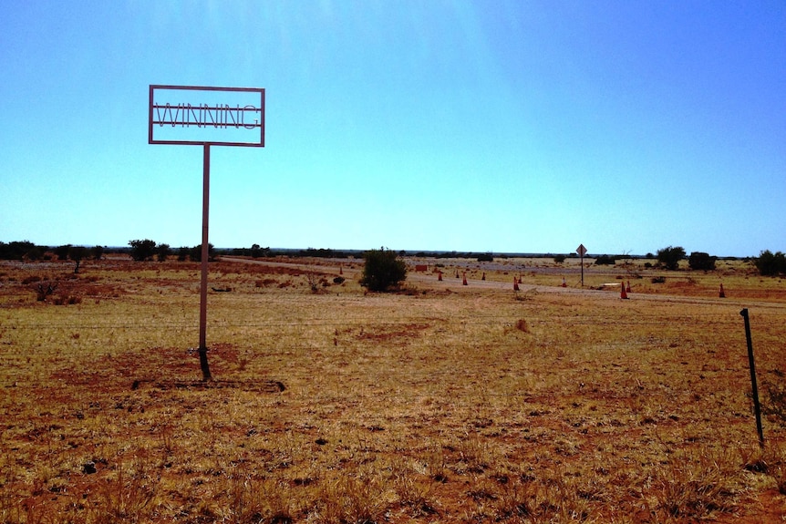 Station sign in a paddock