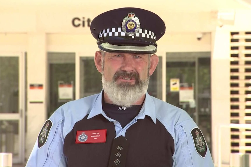 A policeman in uniform.