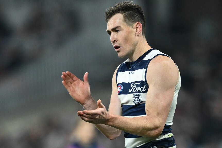 Jeremy Cameron claps durng Geelong's AFL win over Hawthorn.