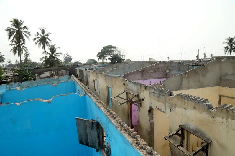 Houses without roof and coloured walls that are abandoned near Abidjan airport in Ivory Coast.