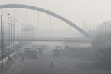 Thick smog is seen at a bus depot in New Delhi