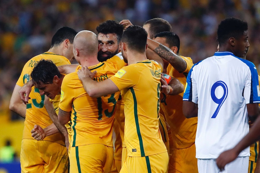 Socceroos mob Mile Jedinak after goal against Honduras