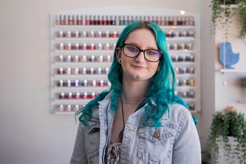 A young woman in a nail salon.