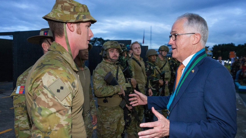 Malcolm Turnbull speaking to soldier