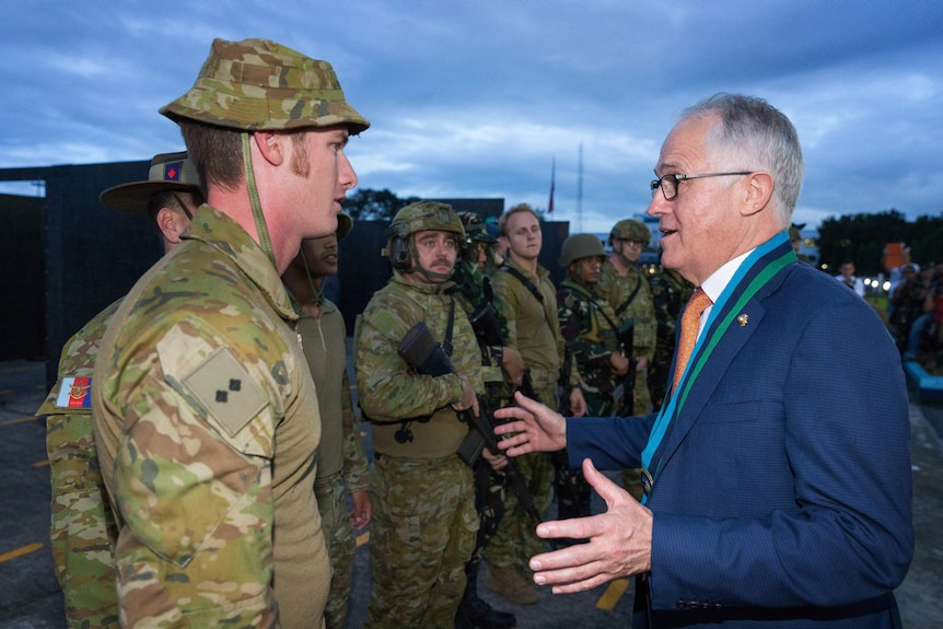 Malcolm Turnbull speaking to soldier