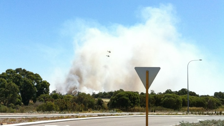 The fire has closed roads near the airport
