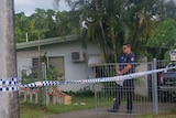 Police guard a home in Woree
