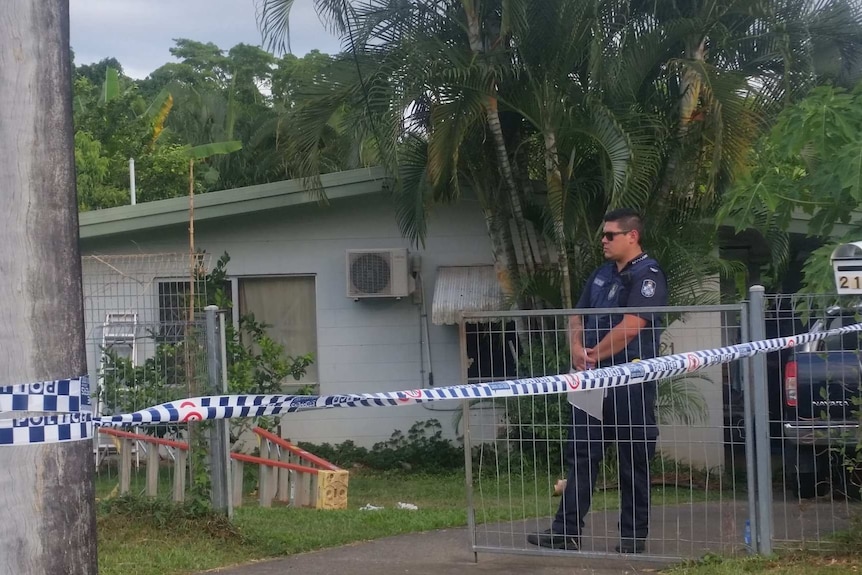 Police guard a home in Woree