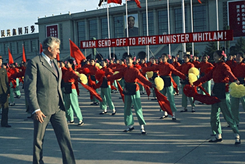 A 1970s photo of Gough Whitlam in a Chinese square, as lines of dancers perform for him