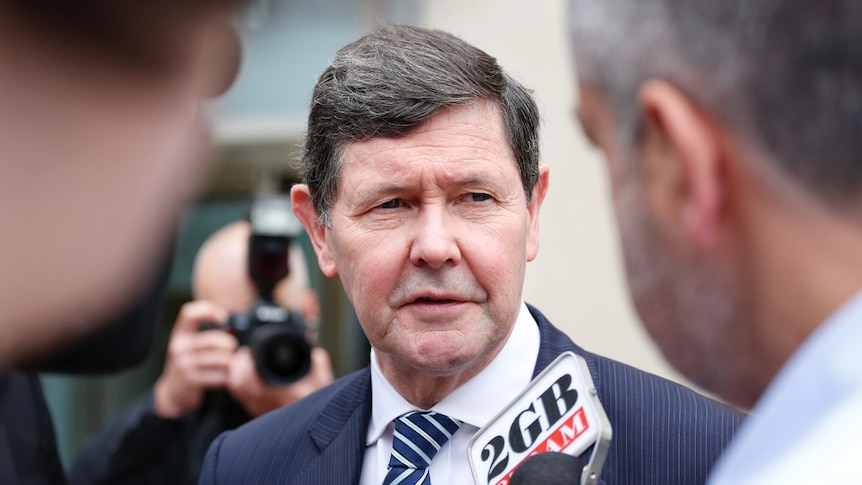 Kevin Andrews speaks to reporters