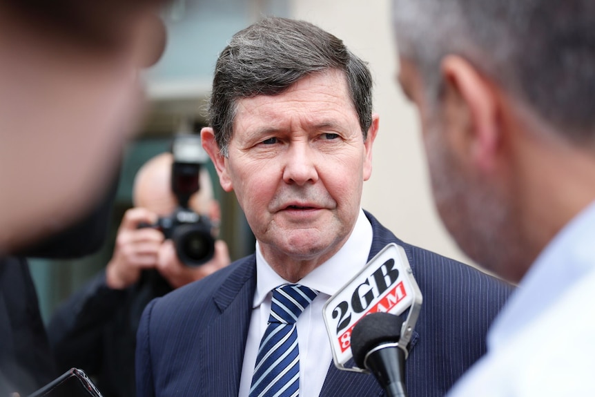 Kevin Andrews speaks to reporters