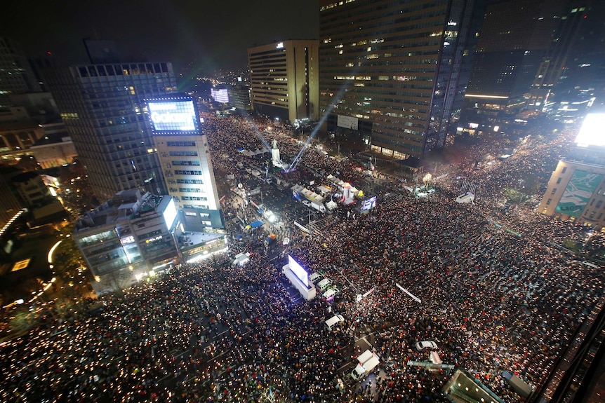 Aerial view of thousands of people gathered in central Seoul.