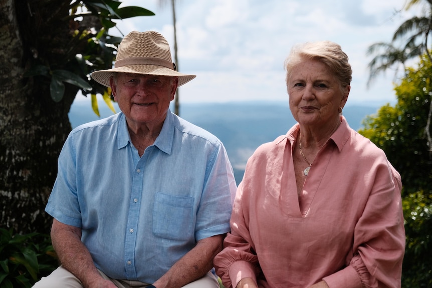 Photo of a man and a woman on a farm smiling.