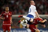A night out in Basel: Rooney gives the Swiss defence a headache.