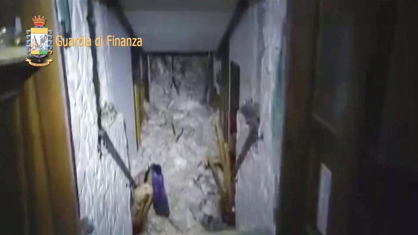 A video still from inside the hallway of the hotel shows the extent of the damage.