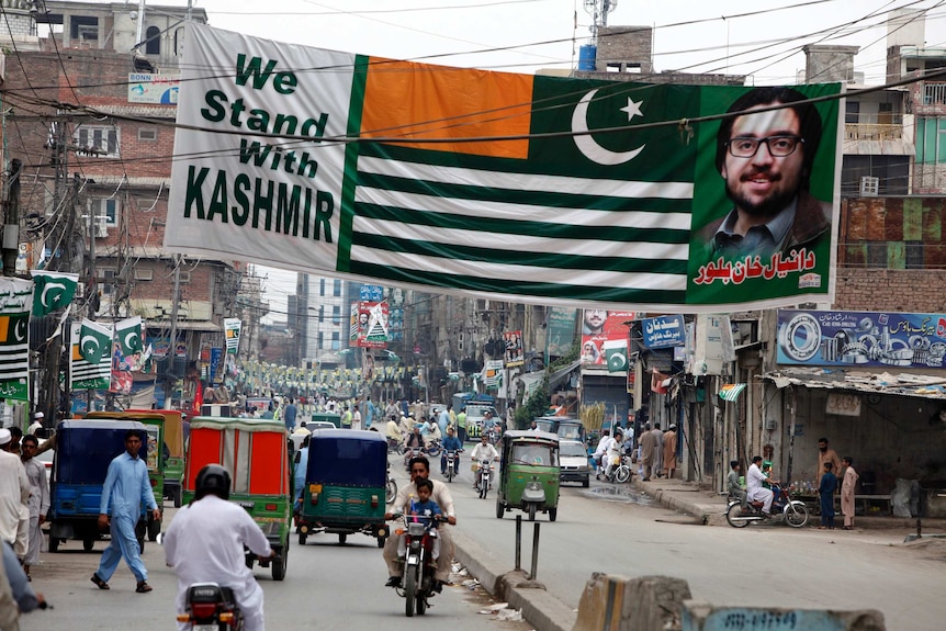 The dense streets of Peshwar in Pakistan are festooned in banners and flags that say "we stand with Kashmir"