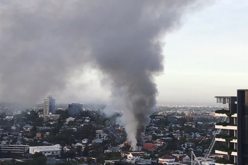 Smoke fills the sky above a South Brisbane unit fire