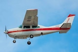 A ChartAir charter plane in the air.