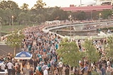 Crowd crosses the Torrens footbridge from Adelaide Oval