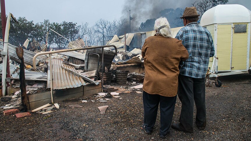 Property owners Jim and Lorraine inspect their destroyed house near Roseworthy in the mid-north of South Australia.