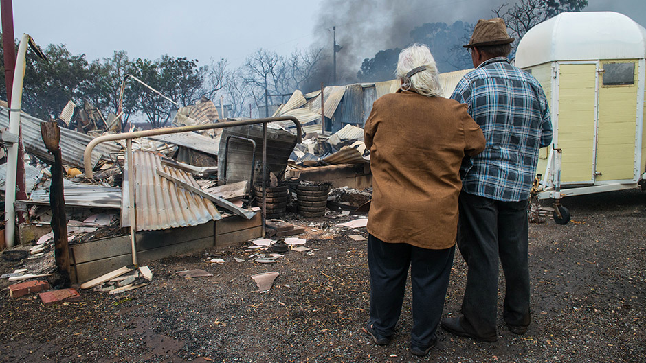 Property owners Jim and Lorraine inspect their destroyed house near Roseworthy in the mid-north of South Australia.