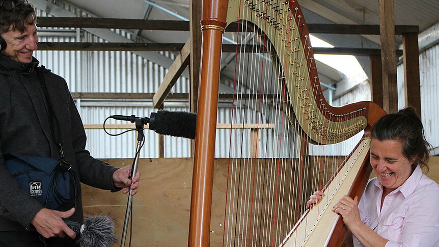 Stuart Thorne recording farmer Keryn Thompson on the harp