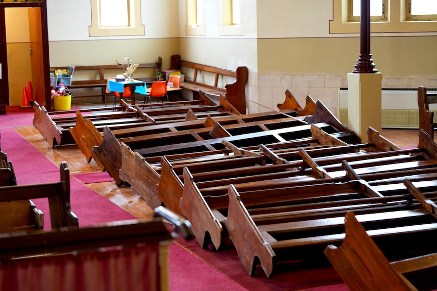 Wooden church pews tipped over by vandals in Broken Hill. 