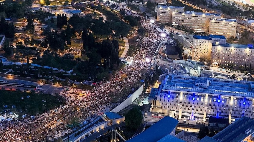 A picture taken from a drone of thousands of protesters outside Israeli parliament in Jerusalem.