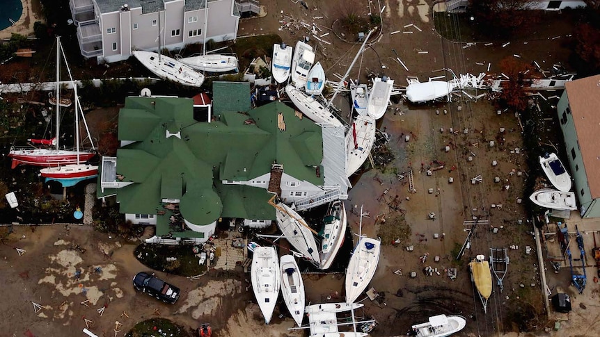 Boats are strewn among buildings in Sea Bright, New Jersey