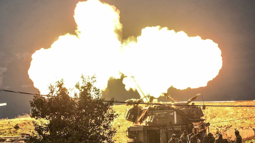 An Israeli artillery gun fires a shell into Lebanon.