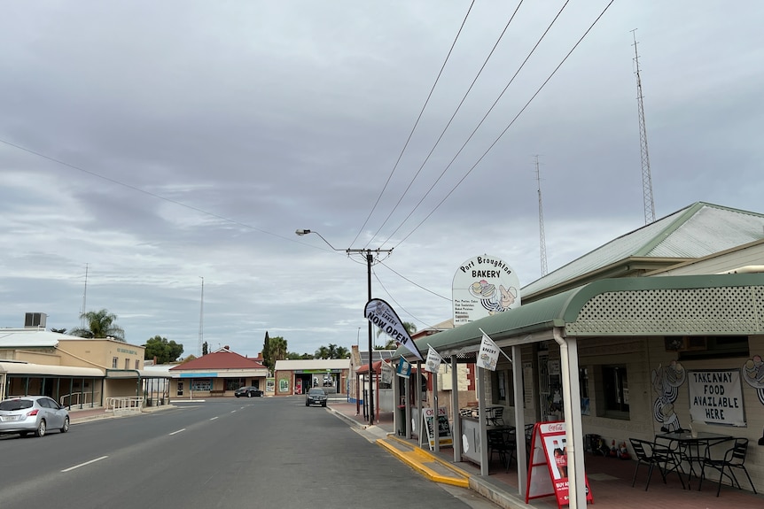 A street in a country town, signs say Port Broughton, and there are many TV towers in the background