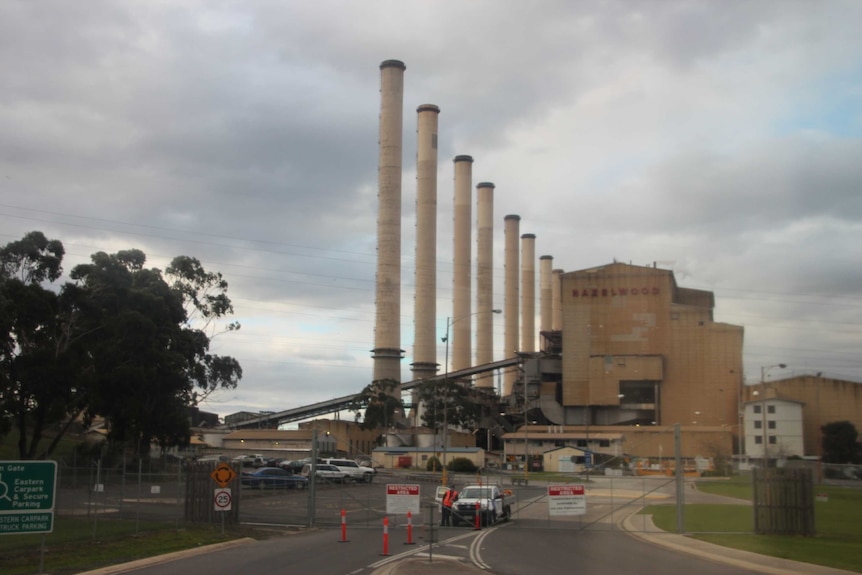 A power station beneath a foreboding sky.